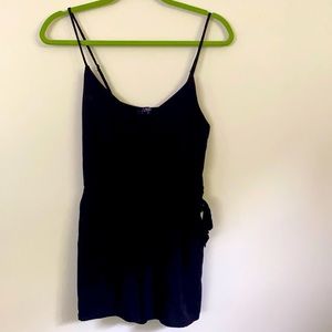 Black romper. Wore once. With bow and pockets.